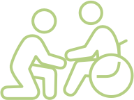 assisted-icon Line art of a person assisting another person in a wheelchair.