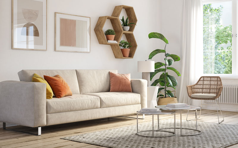virtual-tours Cozy living room with a beige sofa, colorful cushions, and modern decor in natural light.