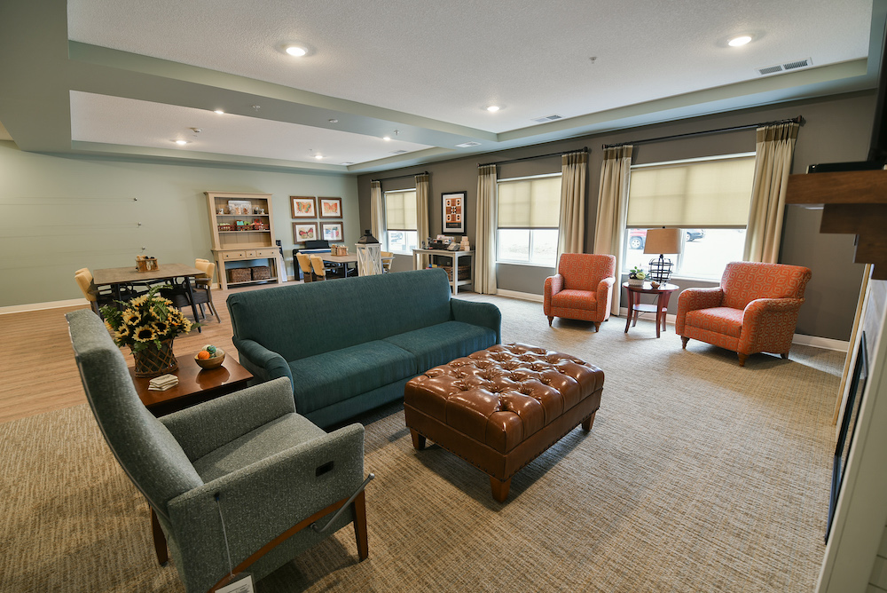 Spacious and neatly arranged living room with modern furniture and natural lighting