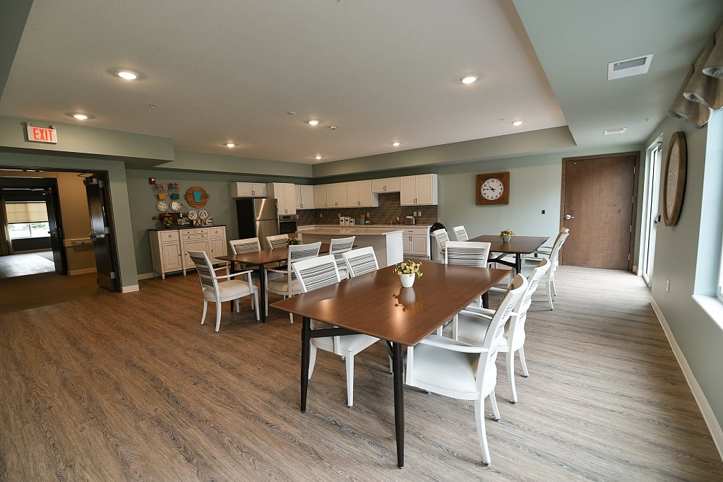 Open common kitchen with tables and chairs